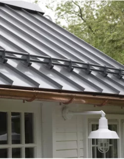 Snow breaks on metal roof